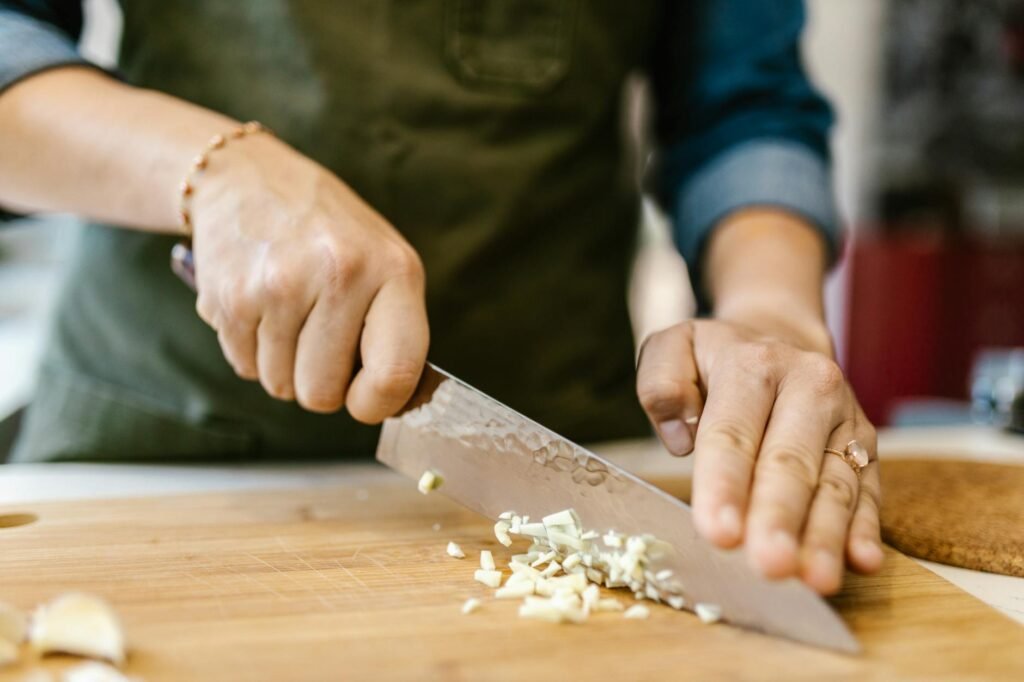 Garlic, turmeric, sage, and fresh ginger on a cutting board