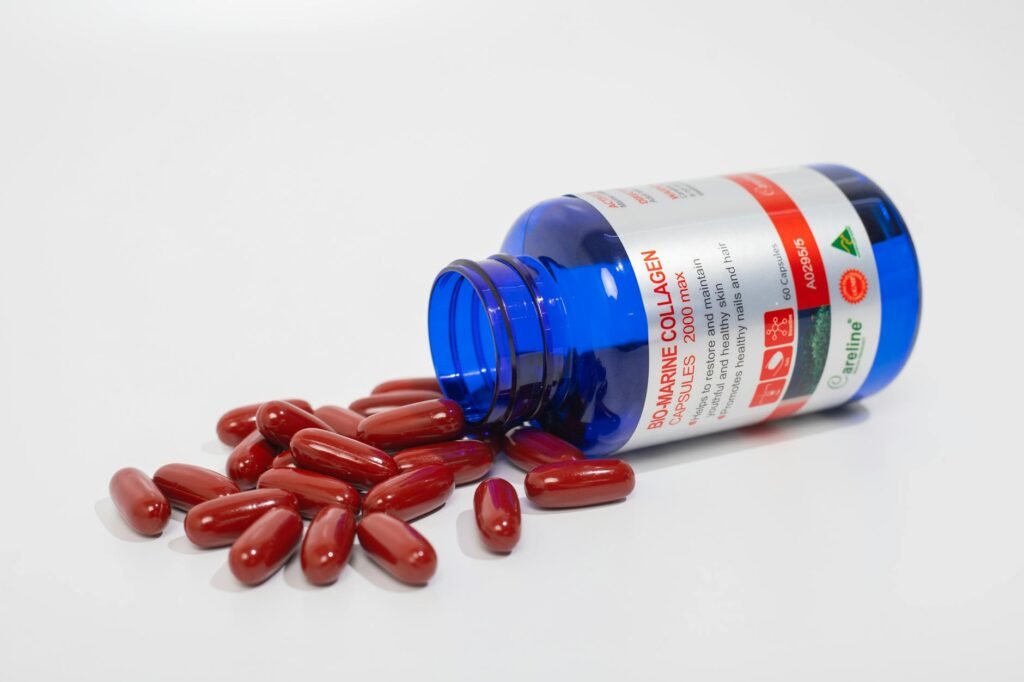 A supplement bottle and ingredient notes on a desk