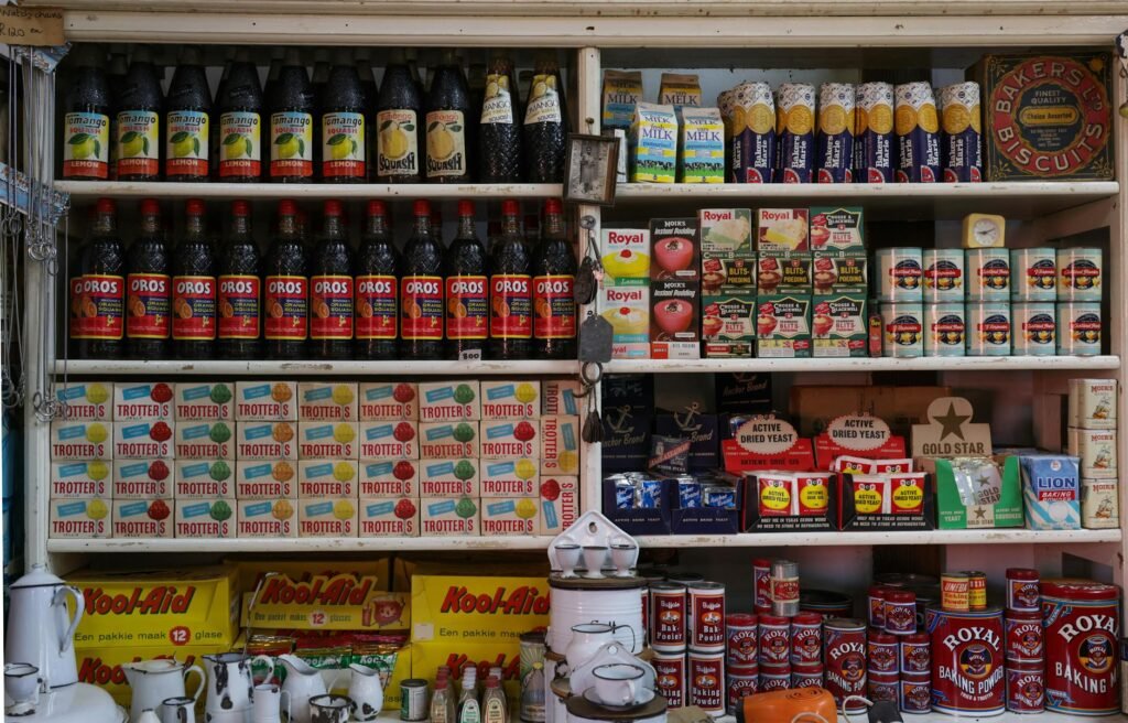 Tea boxes and supplement bottles arranged neatly on a pantry shelf