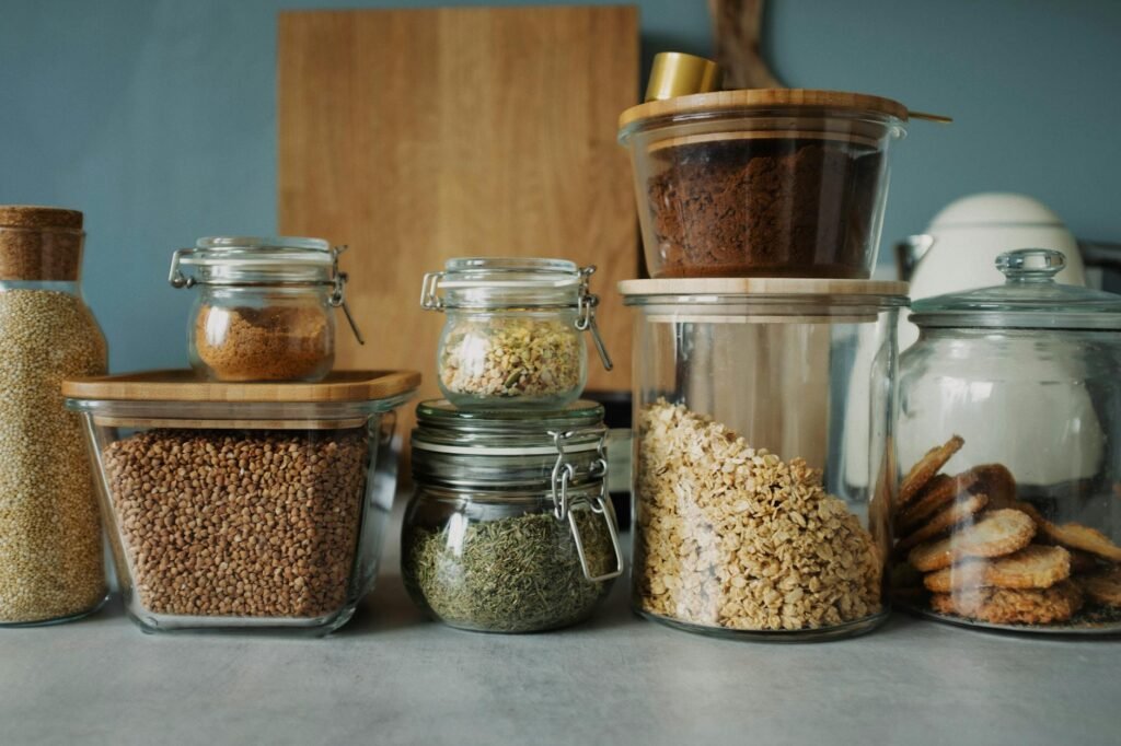 Fresh herbs stored neatly in the refrigerator and dried herbs stored in pantry jars