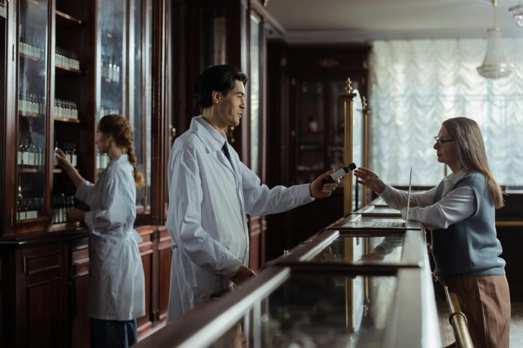 A pharmacist reviewing a supplement label with a customer