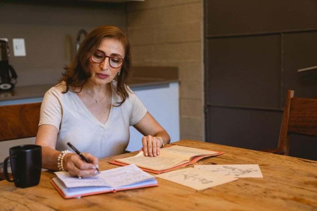 A person reviewing a supplement label with notes beside them