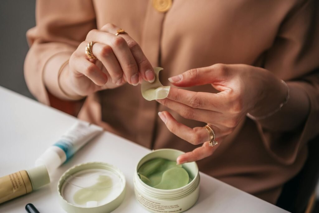 A person applying a small amount of skincare product to the inner arm for testing.