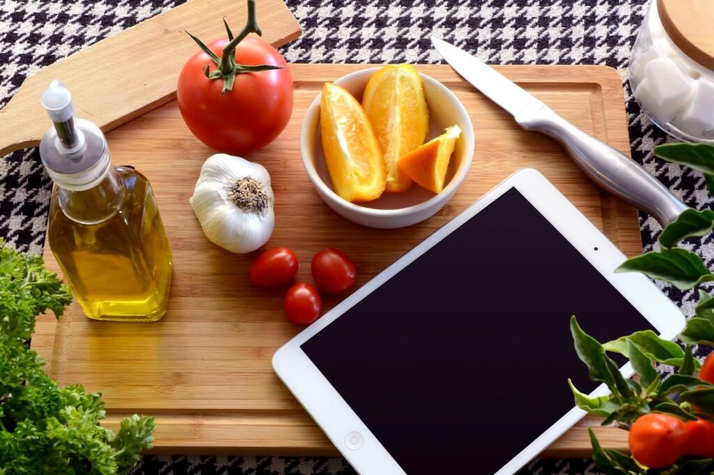 Kitchen workspace with herbs, a grocery receipt, and a handwritten meal plan