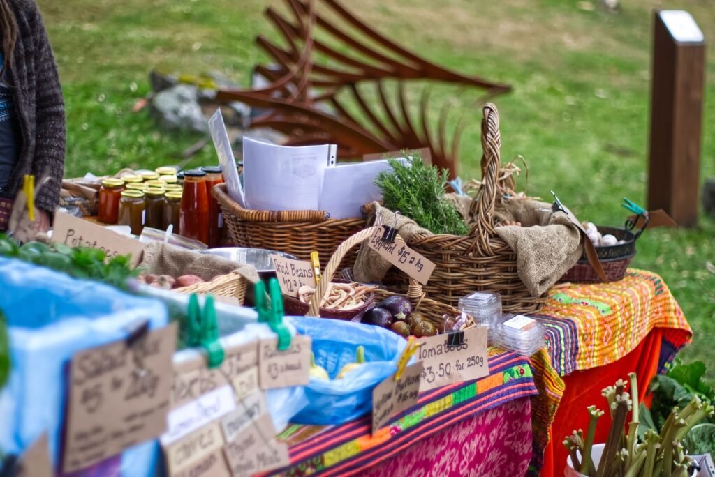Seed packets, receipts, and herb clippings arranged neatly on a desk.