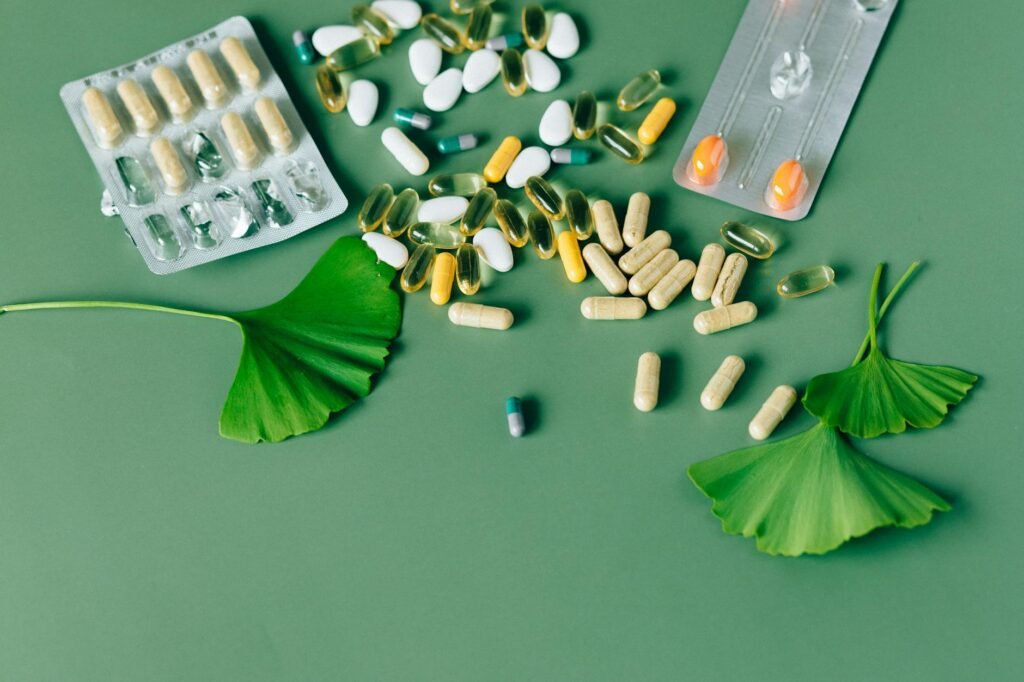 A supplement bottle next to a medication list and notes from a pharmacist consultation.