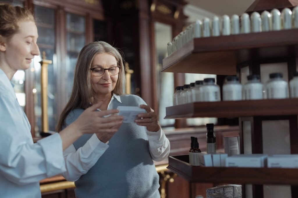 Pharmacist reviewing a supplement label with a customer